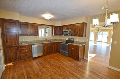 Huge eat-in kitchen with custom made cabinets, sta