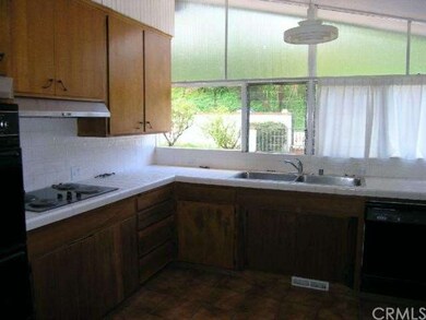 Kitchen has high ceilings, electric appliances
