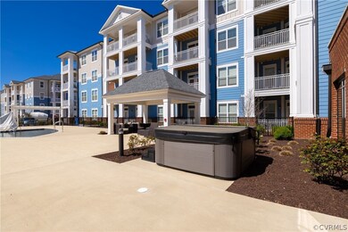 View of property's community featuring a jacuzzi