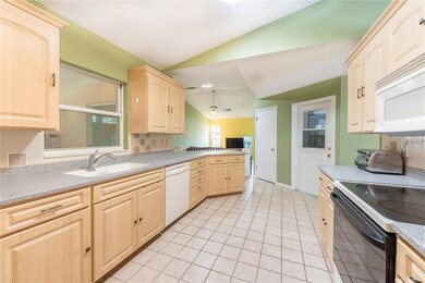 Kitchen boasts plenty of cabinet & counter space p