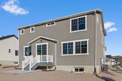 Rear view of house with stucco siding