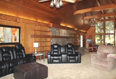 Large living room with cathedral ceilings and built-ins.