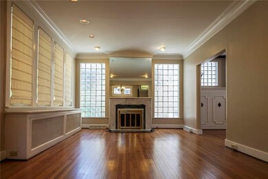 Formal living room with decorative fireplace, rece