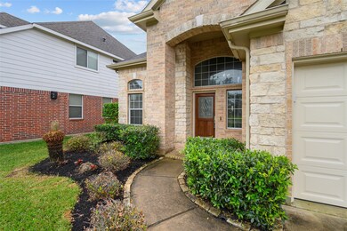 Well maintained and landscaped front yard with walkway to the covered front entry.