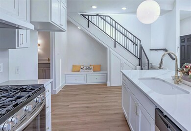 Kitchen featuring light wood finished floors, whi