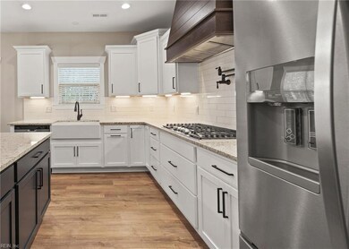 Kitchen with optional gas range and hood vent from a similar build