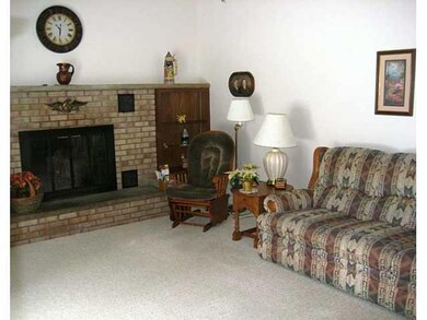Great Room. The wood burning fireplace is surround