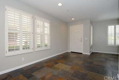 Entry Showing Plantation Shutters in Living Room a