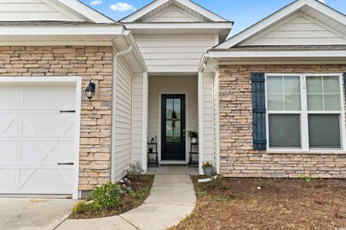 Property entrance featuring a garage