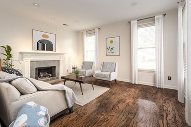 Living room featuring dark wood-type flooring, a f