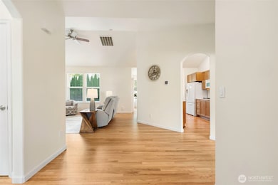 Inviting entry with an open layout and beautiful hardwood floors flowing throughout