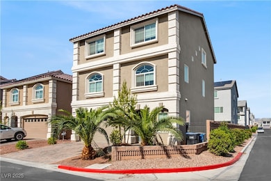 View of property with stucco siding, decorative driveway, and a tile roof