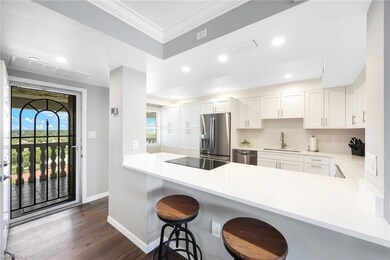 Kitchen with a breakfast bar area, stainless steel
