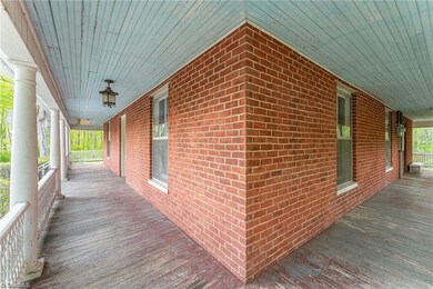 Full wraparound porch.