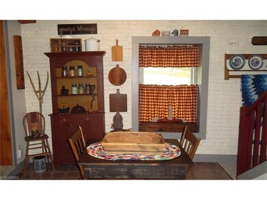 Eat in kitchen with ceramic tile flooring.