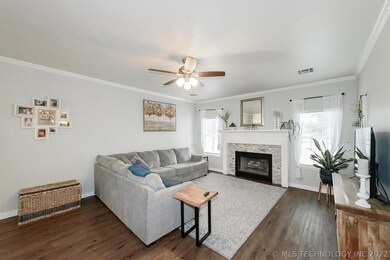 Large living with lots of natural light and firepl