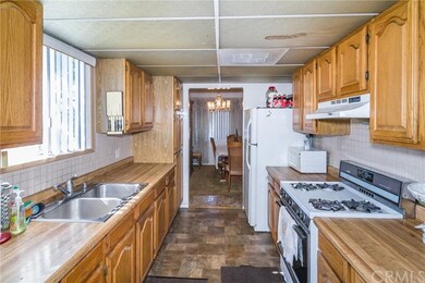 NICE LONG KITCHEN WITH LOTS OF NATURAL LIGHT