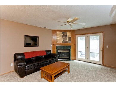Gas fireplace with oak mantel/wall and green marbl