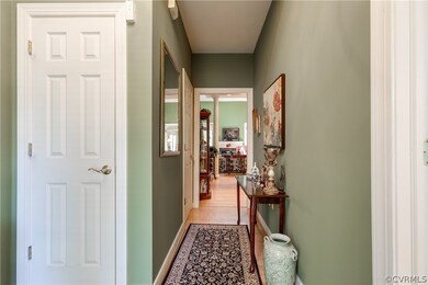 Formal entrance hall with coat closet and powder r