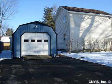 Exterior Back. The side yard offers a long, double