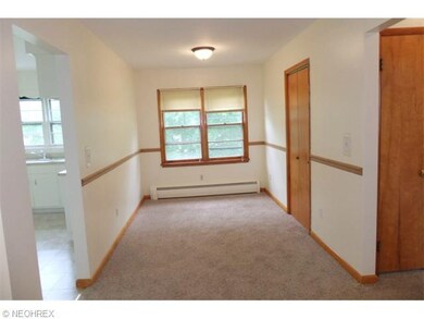 Second floor unit - dining room with new carpeting