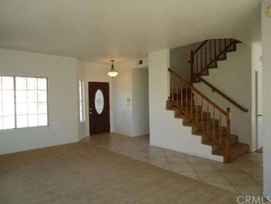 Foyer, stairs and partial view of living room