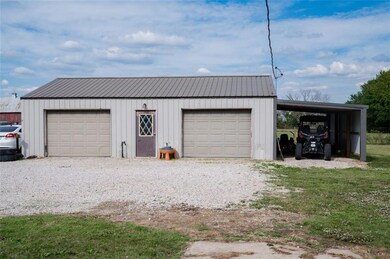 Garage featuring a detached garage