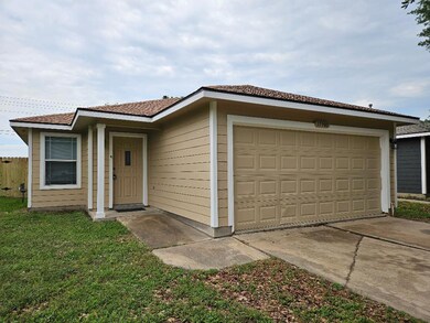 Ranch-style home with a garage and concrete drive