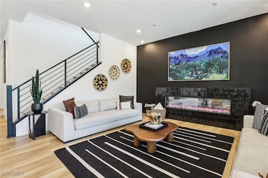 Living area featuring stairs, wood finished floors