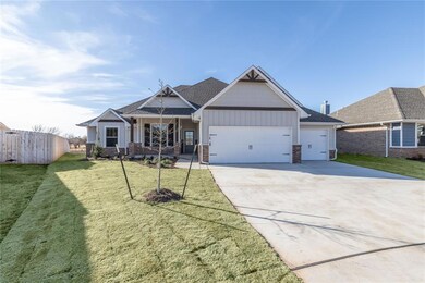 Craftsman-style home with a front yard and a garag