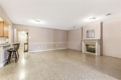 OPEN LIVING AREA W/FIREPLACE - TERRAZZO FLOORS