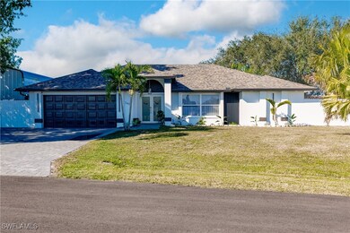 Ranch-style home with french doors, a front lawn,