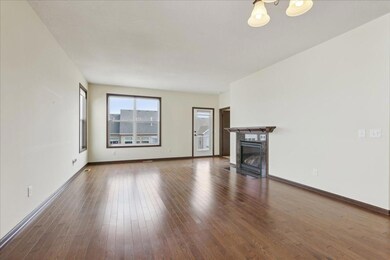 Gleaming hardwood floors and oversized windows throughout main floor