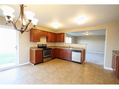 Kitchen. The Kitchen offers Stainless Appliances, Walnut Cabinets and an abundance of Counter and Cabinet Space!!