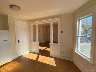 Original Oak hardwood in living room with new durable vinyl flooring in the kitchen.