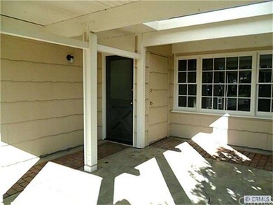 Inviting front patio area has skylight.
