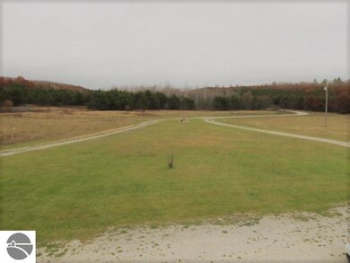 The house is tucked away and has a circular drivew