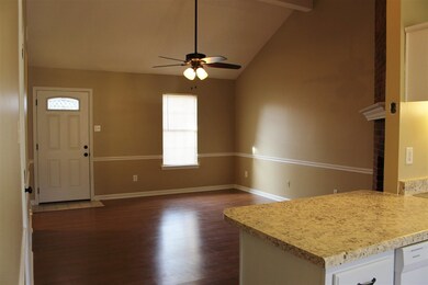 Step into this open concept living room with tall 