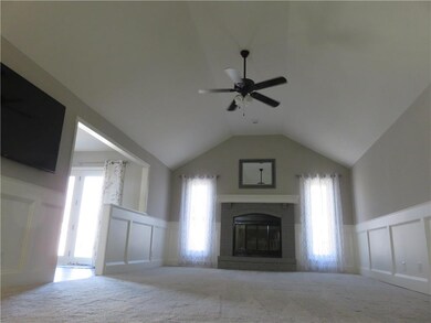 Spacious great room, kitchen to the left.