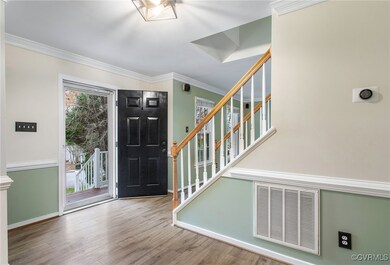 Foyer entrance featuring ornamental molding and ha