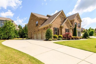 3-Car Garage Side Entry with expansive drive way and parking pad.