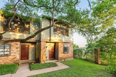 View of front of home featuring brick siding