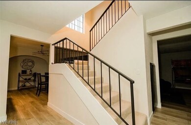 Staircase with wood finished floors