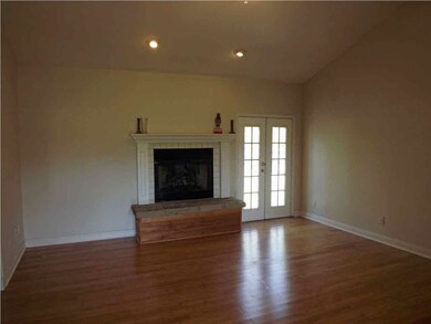 Family room with a nice fireplace.
