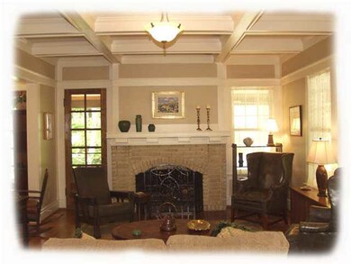 Coffered ceilings and gleaming hardwoods in living