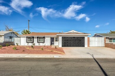 Single story home featuring a garage, fence, and c