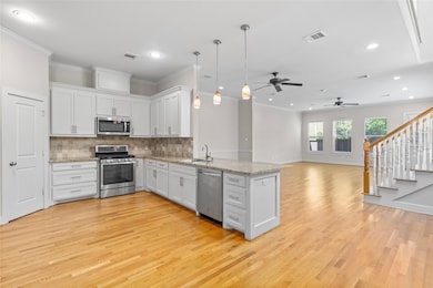 First floor, living area, kitchen, dining, open floor.