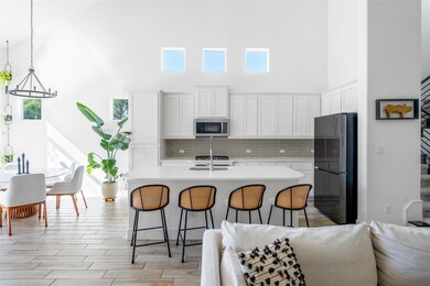 Kitchen featuring appliances with stainless steel