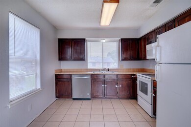 Kitchen with a healthy amount of sunlight, sink, w