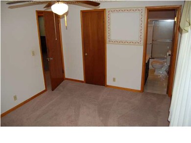 Master bedroom with view of the walk in closet and